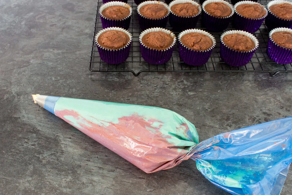 Orange and yellow icing mixed together in the same piping bag.