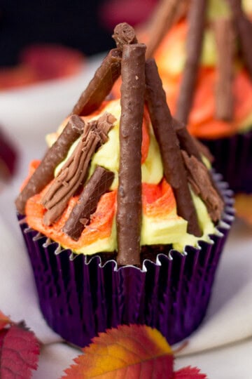 A bonfire cupcake in a purple cupcake case.