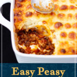 Shepherd's pie in a square white roasting dish with a dirty spoon on top, and a portion spooned out. A text overlay says "Easy peasy Shepherd's pie recipe".