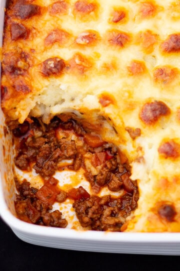 Shepherd's pie in a dish with a spoon at the side