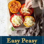 Someone topping stuffed peppers with grated cheese. A text overlay says "easy peasy stuffed peppers recipe".