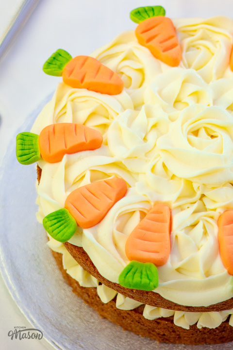 Carrot cake decorated with homemade fondant carrots.