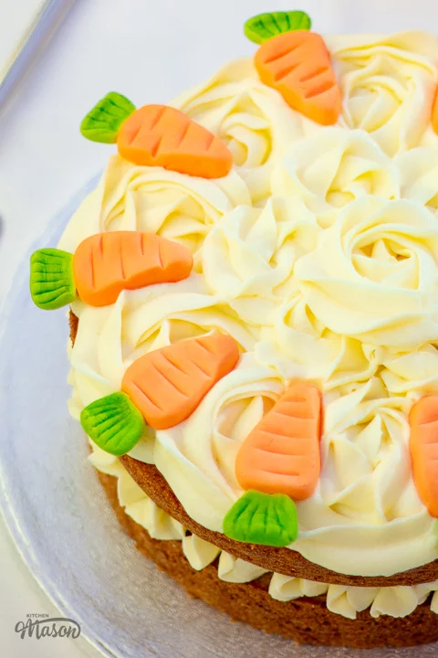 Carrot cake decorated with homemade fondant carrots.