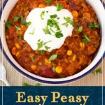 A bowl of chilli con carne and soured cream. A text overlay says "Easy peasy chilli con carne recipe".