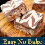 Two Mars Bar Slices on a wooden board. A text overlay says "Easy no bake Mars Bar slice recipe".