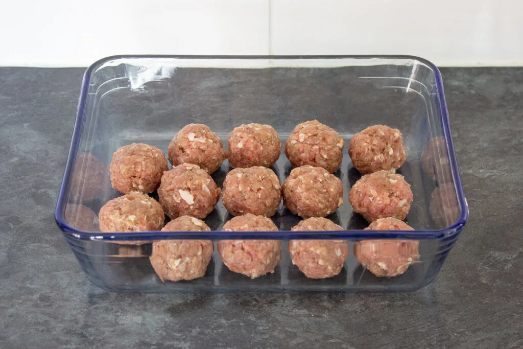 Homemade turkey meatballs in a glass dish.
