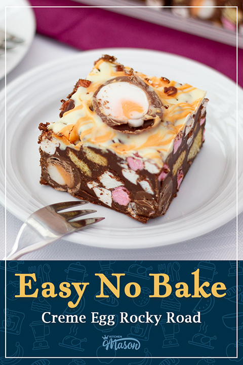 A bar of Cadbury's Creme Egg rocky road on a white plate with a small fork. A text overlay says "Easy no bake creme egg rocky road".