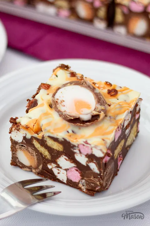 A large bar of Creme Egg rocky road on a white plate.