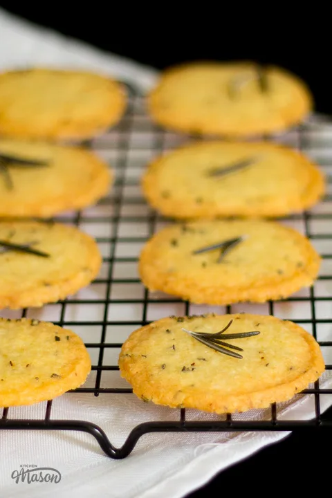 Spicy rosemary crackers on a wire rack.