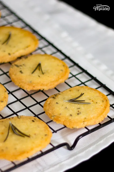Rosemary crackers topped with sprigs of rosemary.
