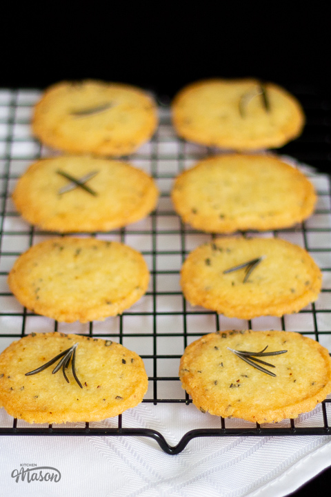 A rack of crackers set over a white table cloth.