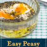 A glass ramekin containing thyme baked eggs. A text overlay says 'Easy Peasy thyme baked eggs'.
