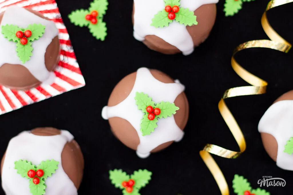 Tunnocks Christmas pudding teacakes with gold curling ribbon around it.