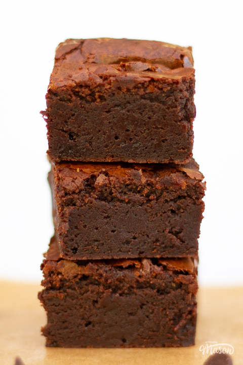 Close up of luxurious chocolate brownies in a stack.