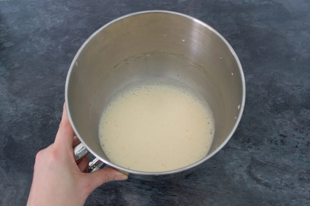 Whisked eggs in a mixing bowl.