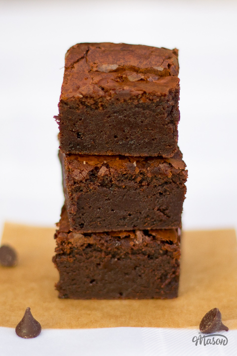 A stack of 3 fudgy chocolate brownies.