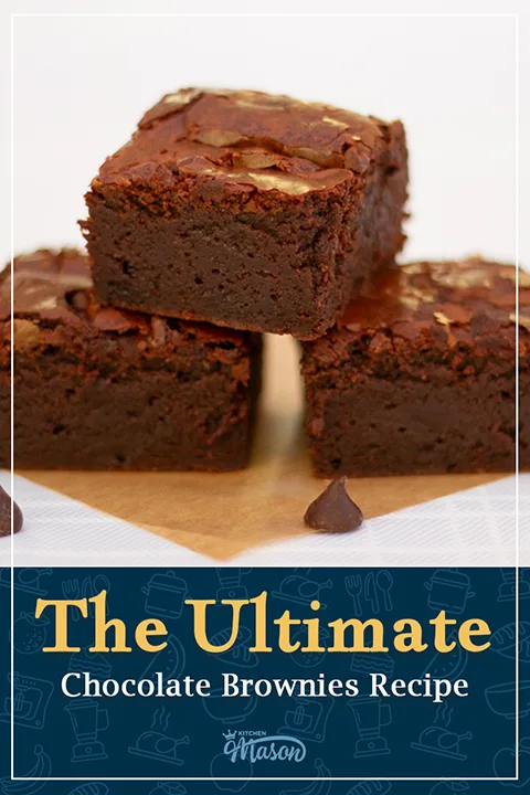 3 fudgy brownies in a pyramid on baking paper. A text overlay says "the ultimate chocolate brownies recipe".