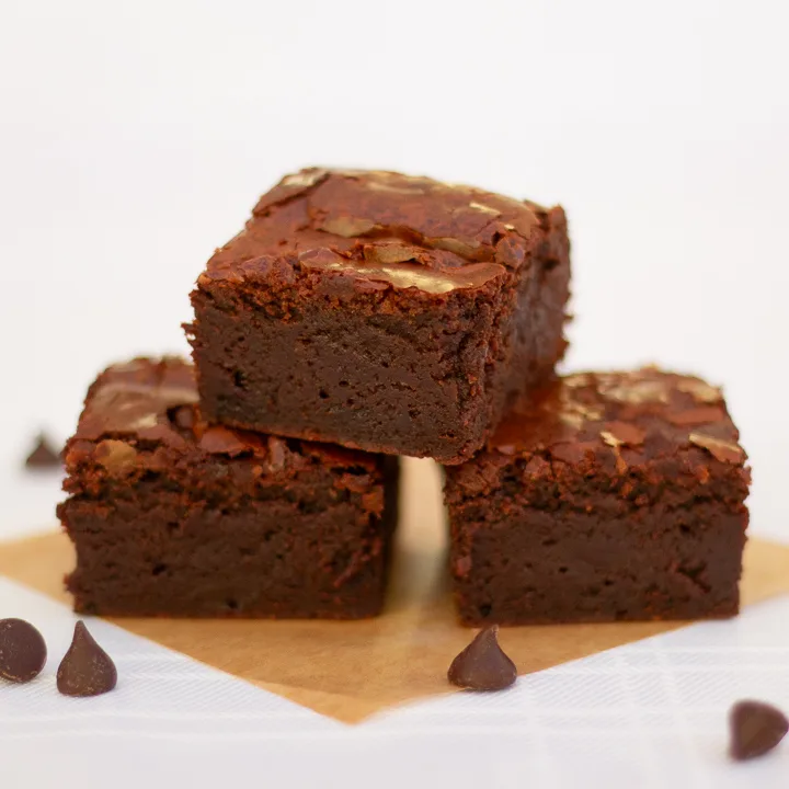 3 chocolate brownies in a tower.