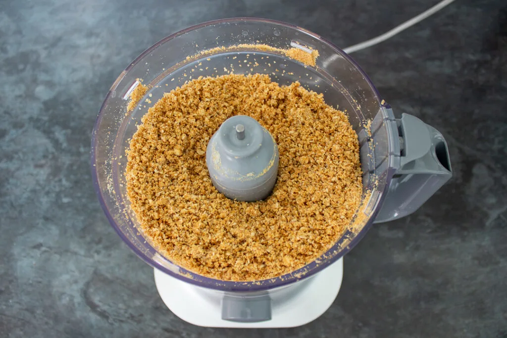 Biscuit crumbs and melted butter in a food processor.