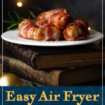 Air fried pigs in blankets on a white plate with a rosemary sprig. A text overlay says "Easy air fryer pigs in blankets".