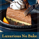 Someone pressing a fork into a slice of no bake chocolate orange cheesecake on a plate. A text overlay says "Luxurious no bake chocolate orange cheesecake".