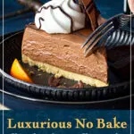 Someone pressing a fork into a slice of no bake chocolate orange cheesecake on a plate. A text overlay says "Luxurious no bake chocolate orange cheesecake".