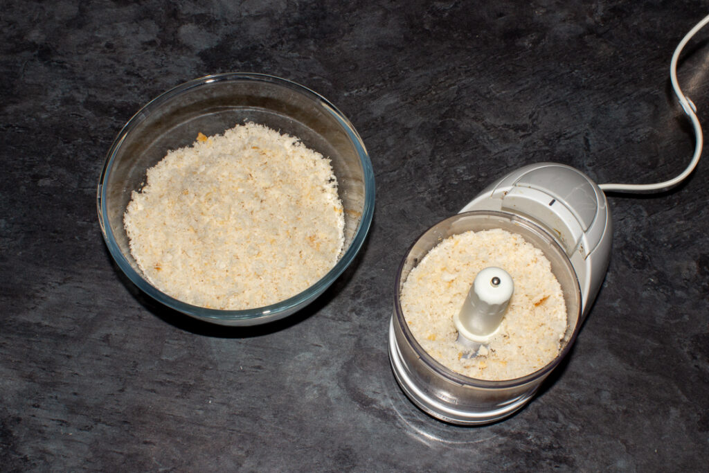 Breadcrumbs in a food processor and large mixing bowl.