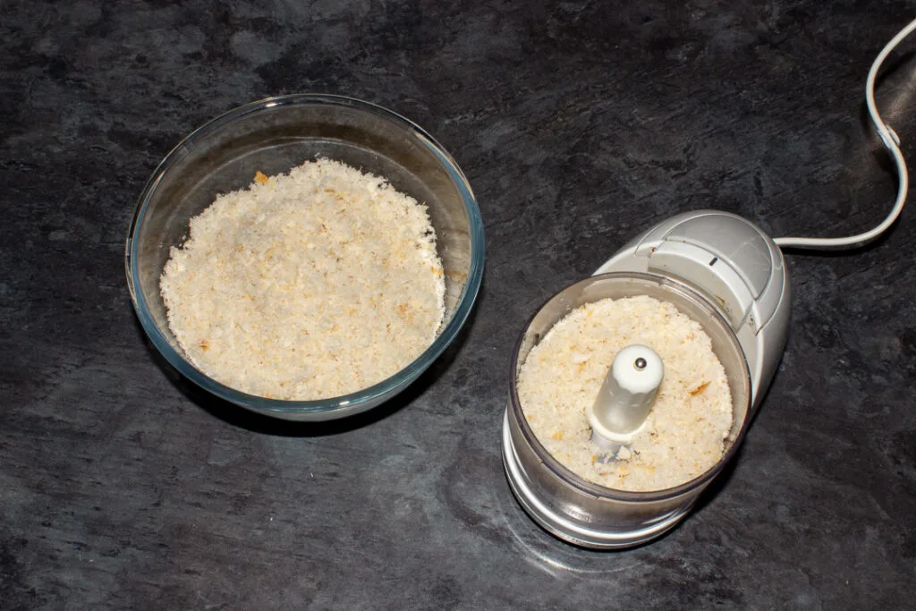 Breadcrumbs in a food processor and large mixing bowl.