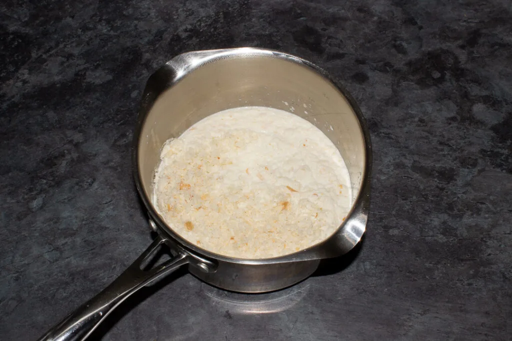 Bread sauce ingredients in a saucepan.