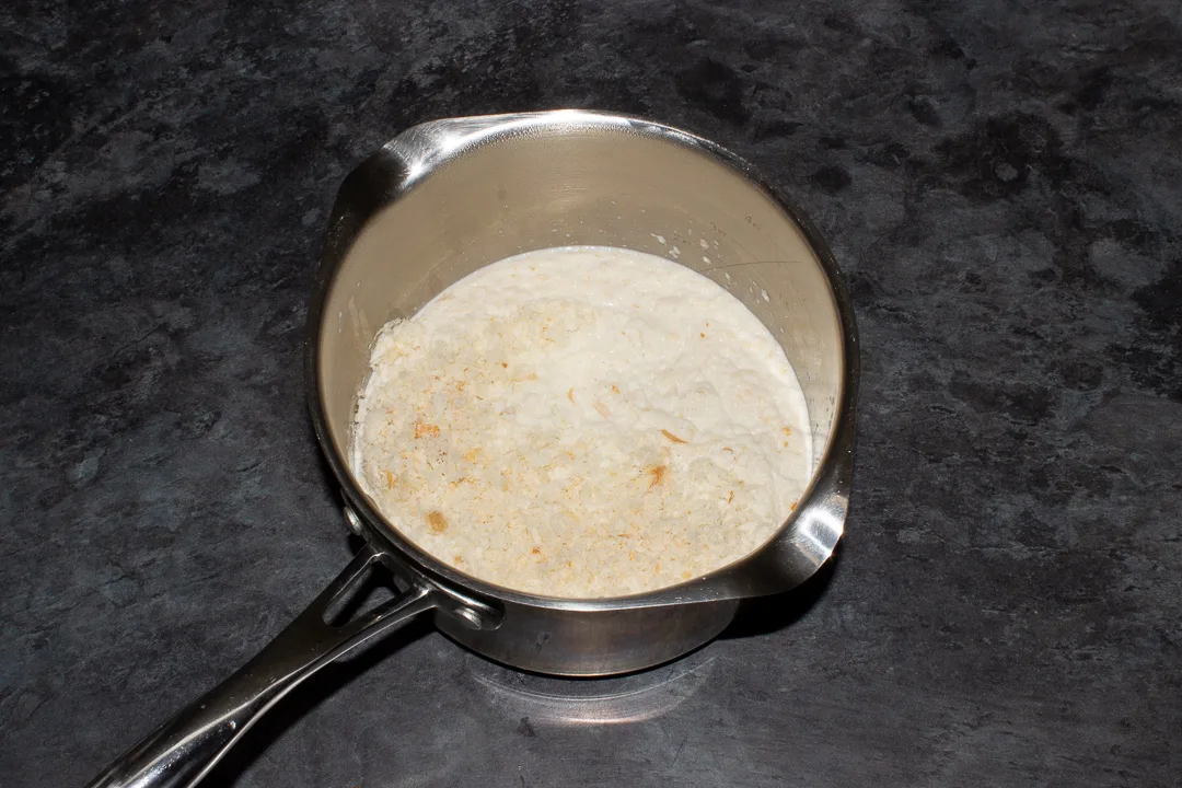 Bread sauce ingredients in a saucepan.
