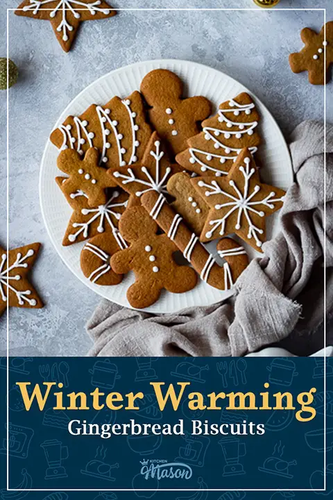 Decorated shaped gingerbread biscuits on a white plate. A text overlay says "Winter warming gingerbread biscuits".