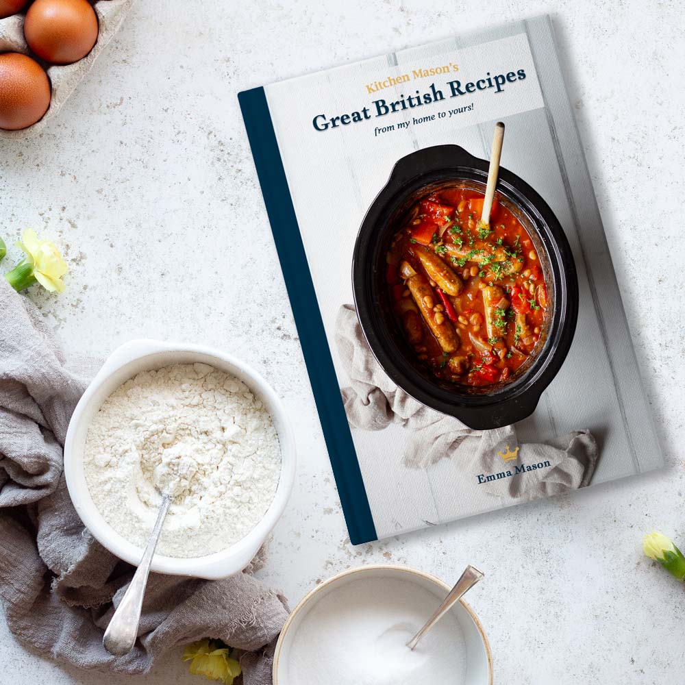 The 'Great British Recipes, from my home to yours' book on a worktop surrounded by ingredients.