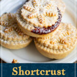 Mince pies on a white plate. A text overlay says "Shortcrust mince pies from scratch".