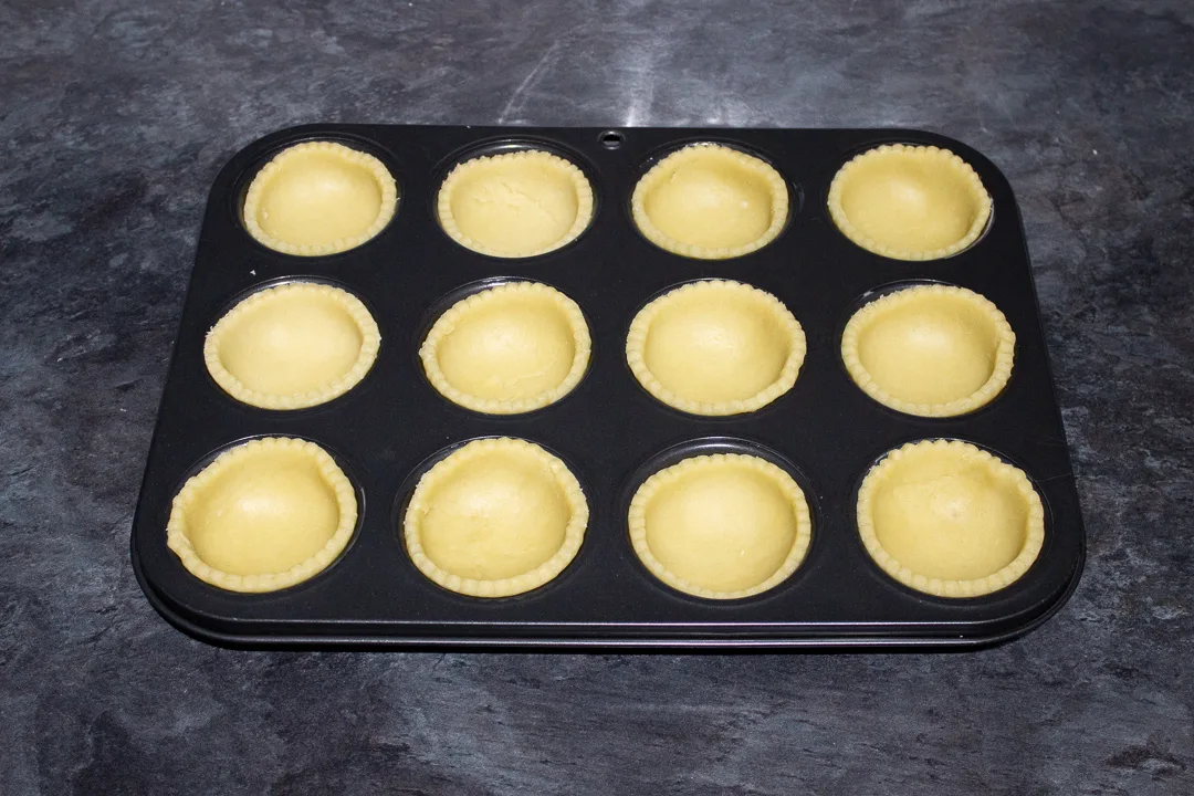 Mince pie shortcrust pastry cases in a pie tin.