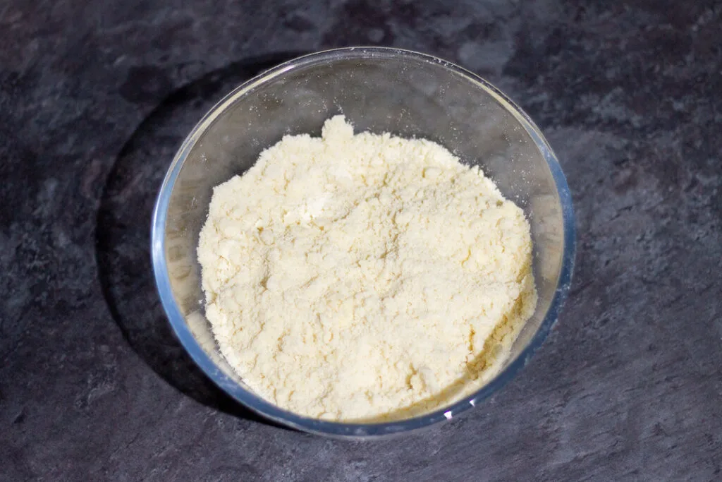 Flour, sugar, butter and salt rubbed together to a breadcrumb consistency in a large glass mixing bowl.