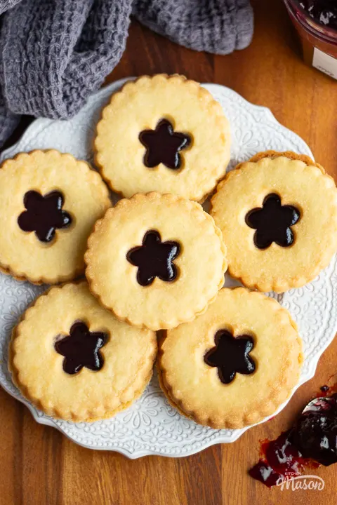 A plate of 6 homemade black cherry jammy dodgers.