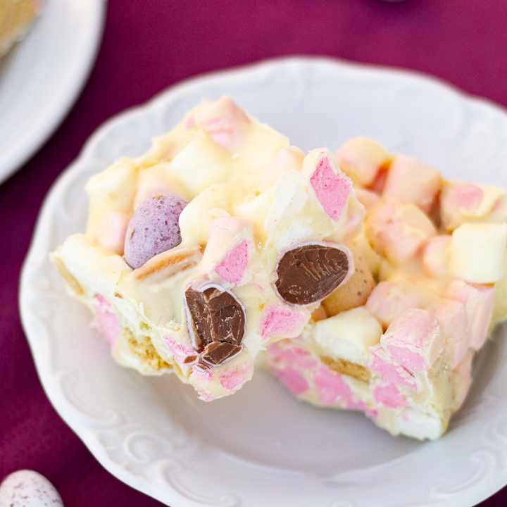 Two squares of Mini Egg rocky road on a white plate.