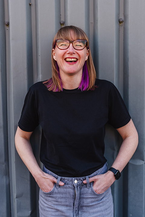 A happy Emma laughing at something.