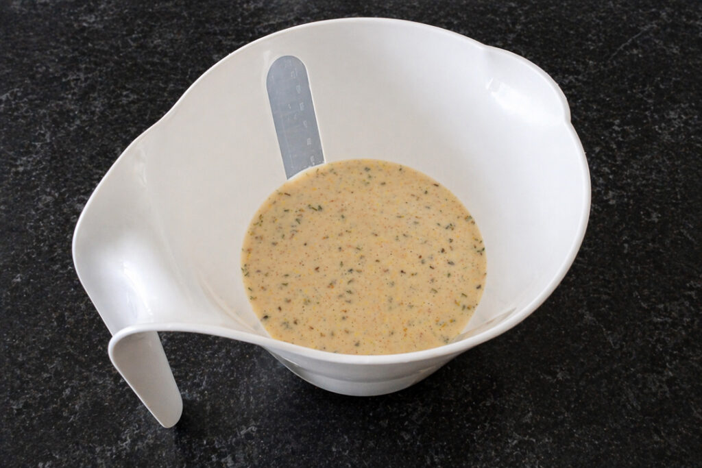 Yorkshire pudding batter in a white jug.