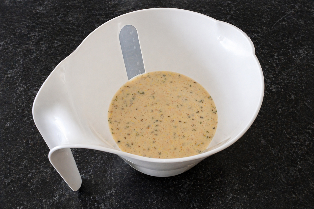 Yorkshire pudding batter in a white jug.