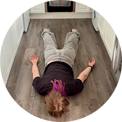 Exhausted Emma face down on the kitchen floor, too tired to cook.