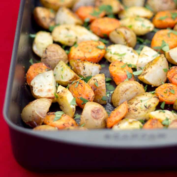 A roasting pan filled with roasted vegetables.