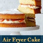 A slice of air fryer victoria sponge cake being held up on a cake slice. A text overlay says 'air fryer cake, that actually works!'