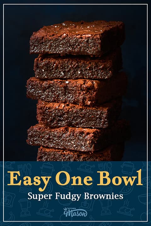 Super fudgey brownies in a stack against a dark blue backdrop. A text overlay says 'Easy one bowl super fudgy brownies'.